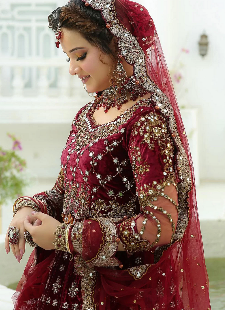 Photo of A beautiful bridal shot in a heavy red bridal lehenga.