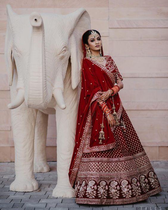 Photo of A bride in red lehenga and double dupatta